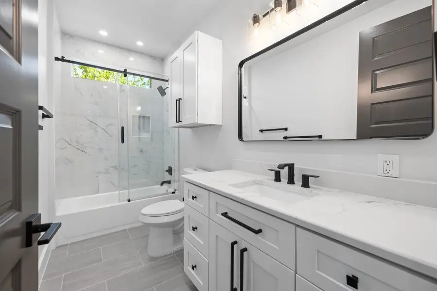 The upper-level full bathroom near bedroom 3. The upper-level full bathroom near bedroom 3.