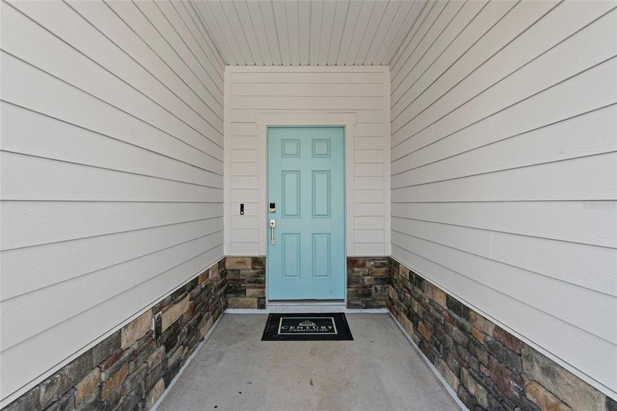 Front exterior of a new home in The Cypress Series at Reserve East, Flagler Beach, FL, highlighting curb appeal (Image 24). Front exterior of a new home in The Cypress Series at Reserve East, Flagler Beach, FL, highlighting curb appeal (Image 24).