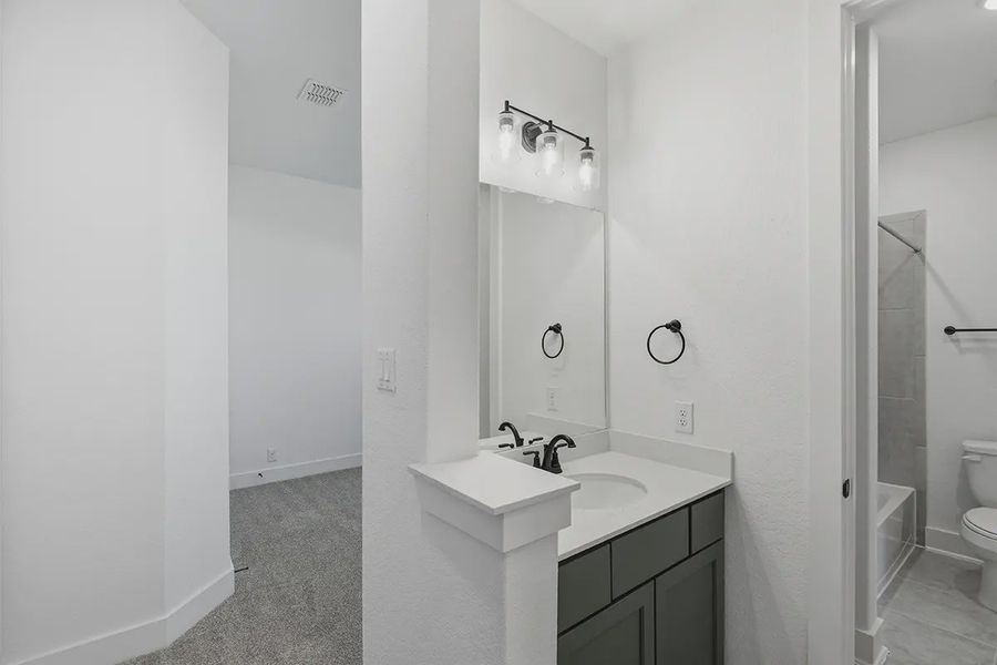 Representative furnished interior of a home built from the Kingston by Chesmar Homes in Prominence 60's, San Antonio (Image 38).