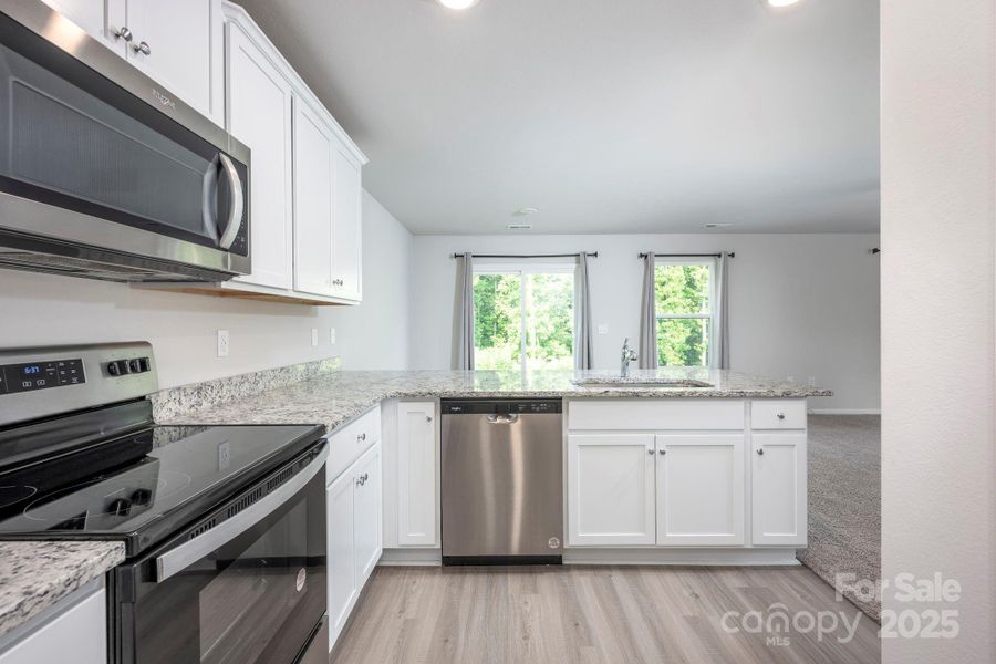 Furnished interior view inside a new home in McKee Creek Village, Charlotte (Image 13).