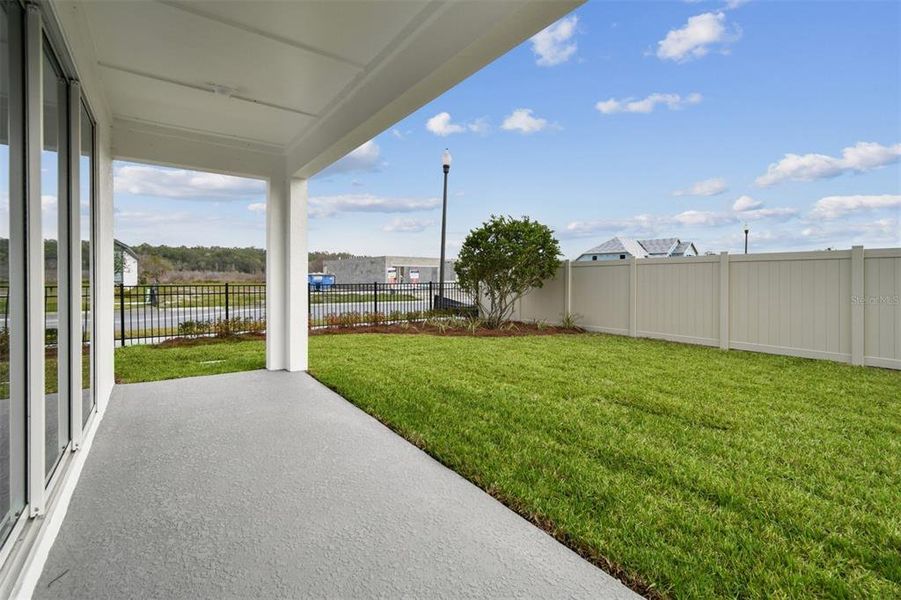 Exterior details and patio area of a home in Oakfield at Mount Dora Village Series, Mount Dora (Image 3).