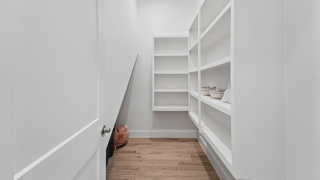 Representative furnished interior of a home built from the Cayman by Chesmar Homes in Crescent Bluff, Georgetown (Image 14).