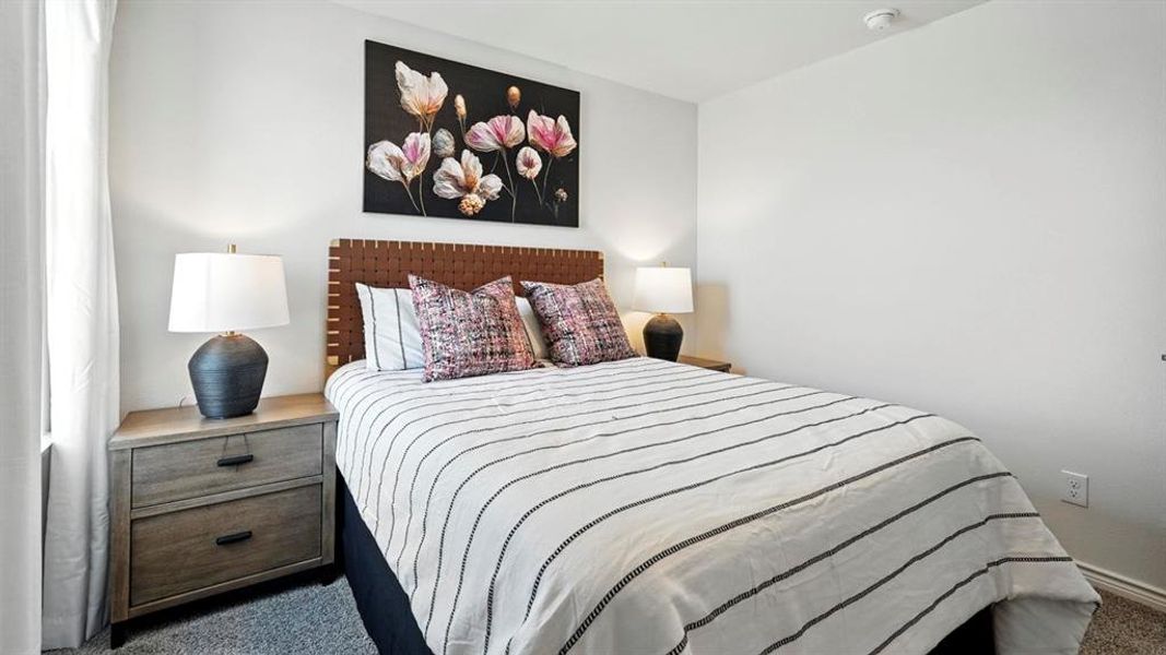 Bedroom featuring dark carpet