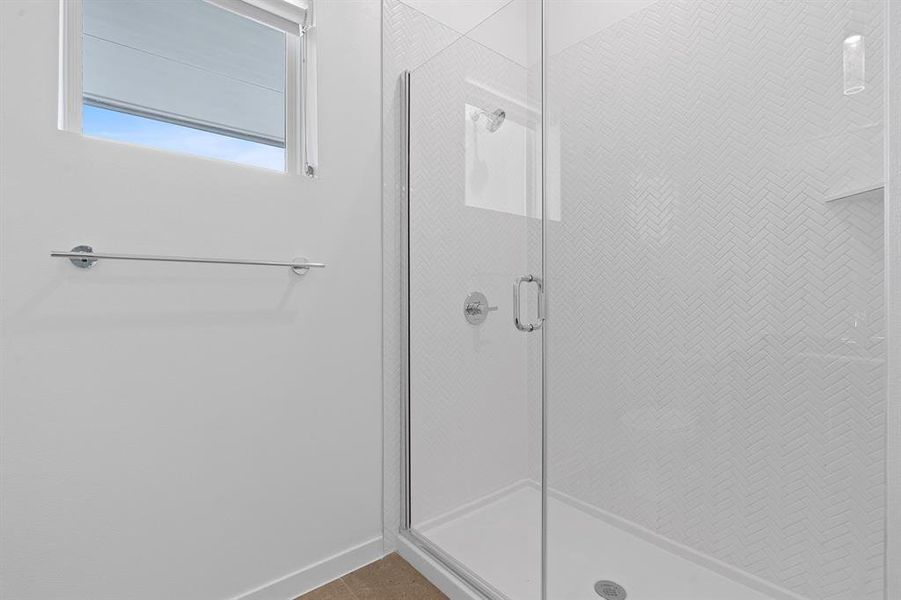 Primary walk-in shower.