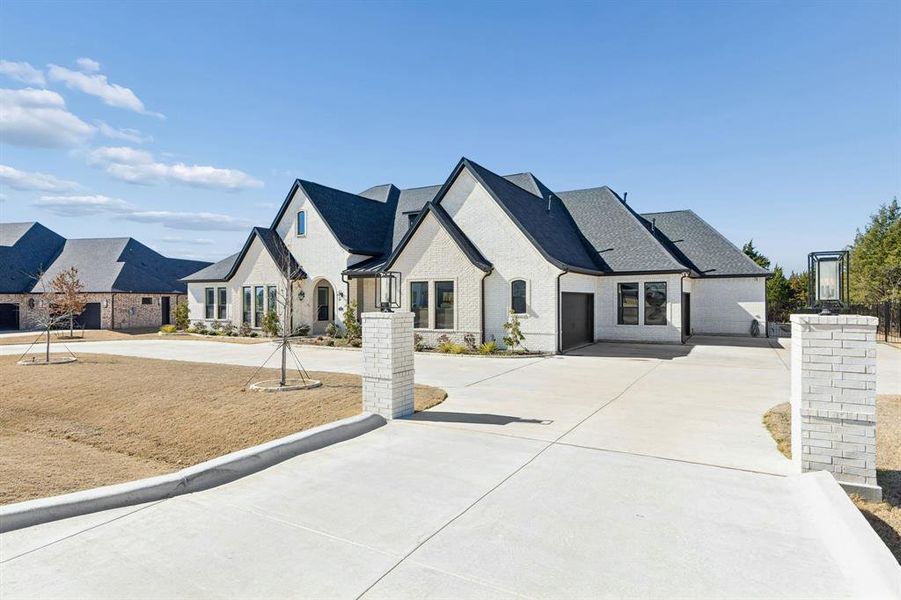 Front exterior of a new home in Lakeview Downs, Lucas, TX, highlighting curb appeal (Image 2). Front exterior of a new home in Lakeview Downs, Lucas, TX, highlighting curb appeal (Image 2).