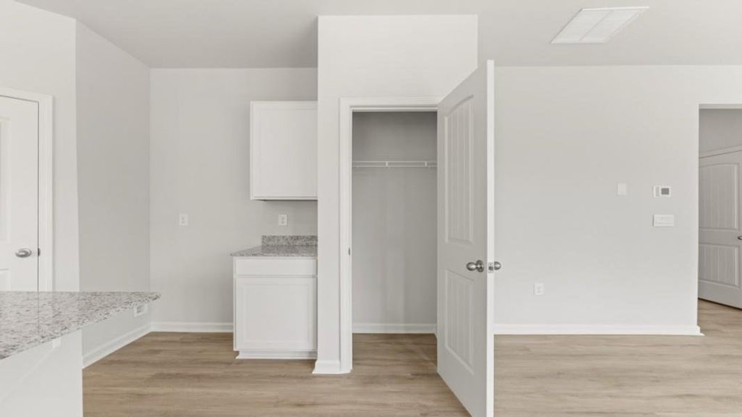 Furnished interior view inside a new home in Oaks at Cedar Grove, Fairburn (Image 11).
