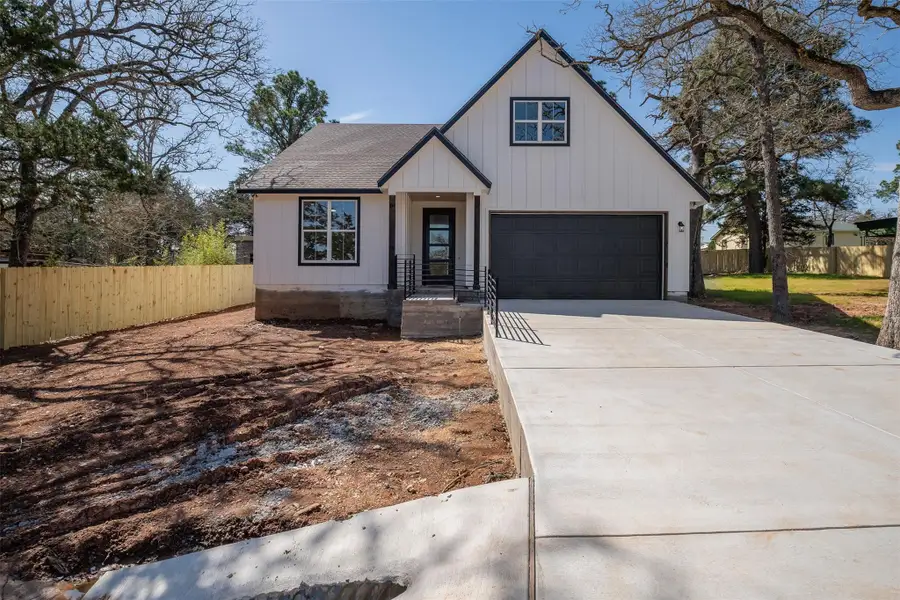 Front exterior of a new home in , Smithville, TX, highlighting curb appeal (Image 11). Front exterior of a new home in , Smithville, TX, highlighting curb appeal (Image 11).