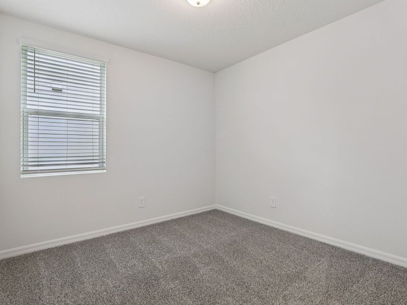 Spacious, unfurnished interior of a new home in The Reserve at Hammock Oaks - Classic Series, Lady Lake (Image 11).