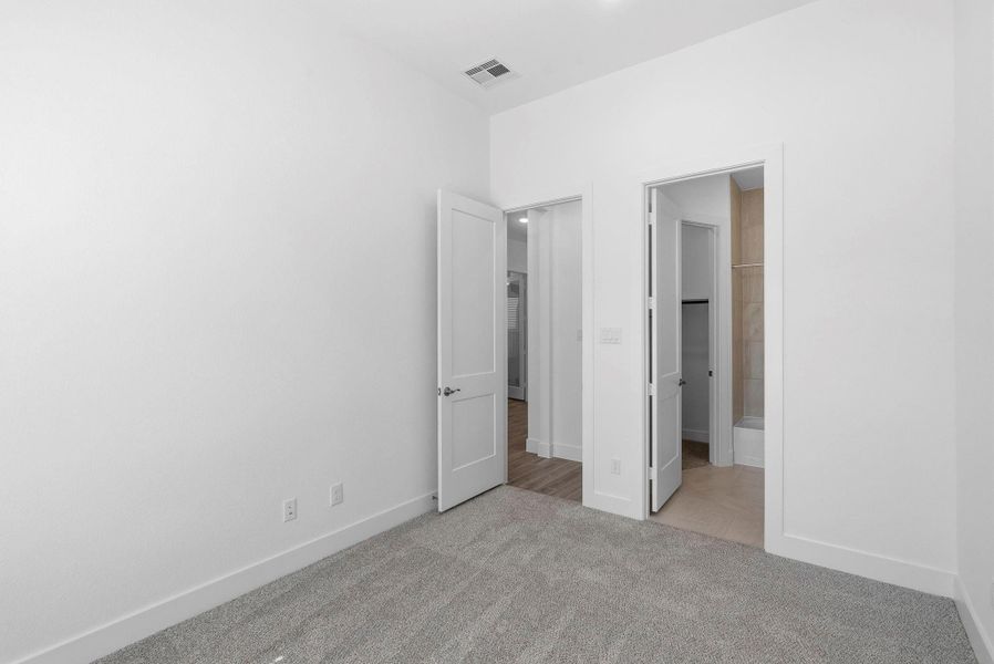 Spacious, unfurnished interior of a new home in Meridiana, Manvel (Image 12).