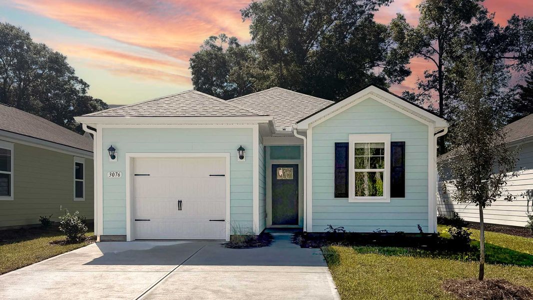 Front exterior of a new home in Southshore Bay, Sunset Beach, NC, highlighting curb appeal (Image 1). Front exterior of a new home in Southshore Bay, Sunset Beach, NC, highlighting curb appeal (Image 1).