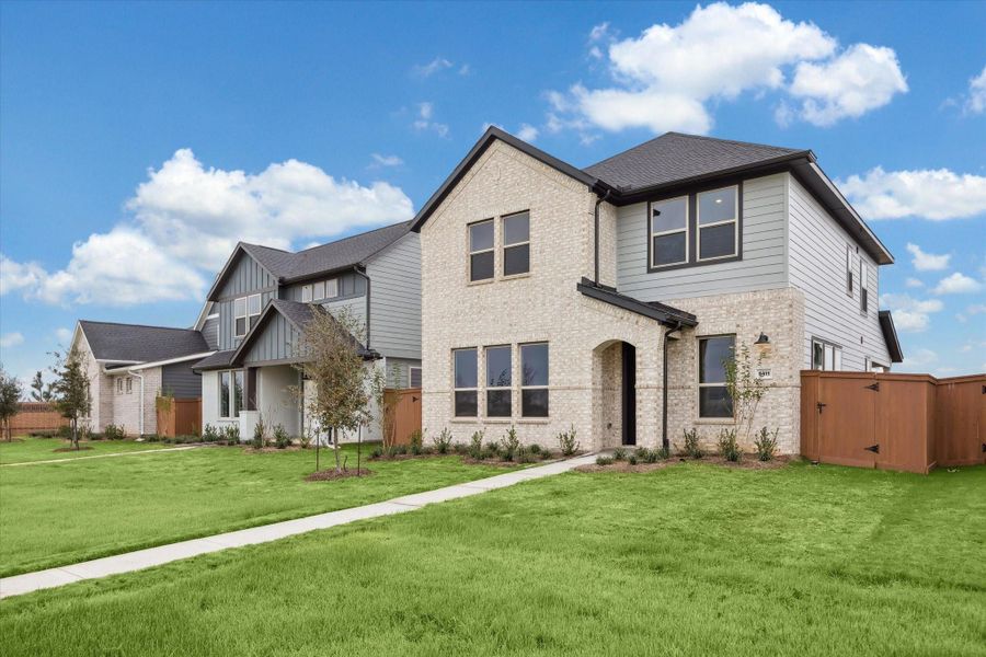 Front exterior of a new home in Elyson, Katy, TX, highlighting curb appeal (Image 22).