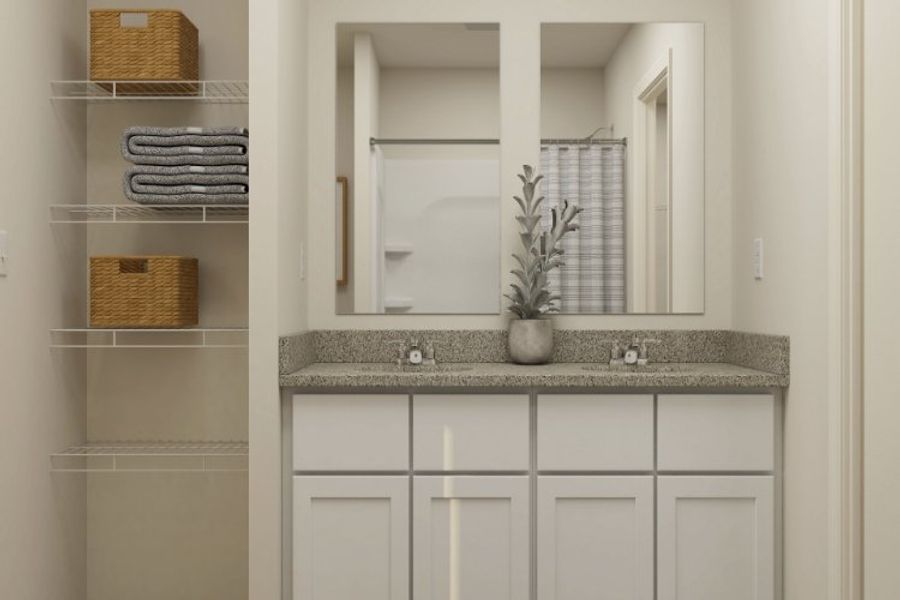 A bathroom with a large mirror. A bathroom with a large mirror.