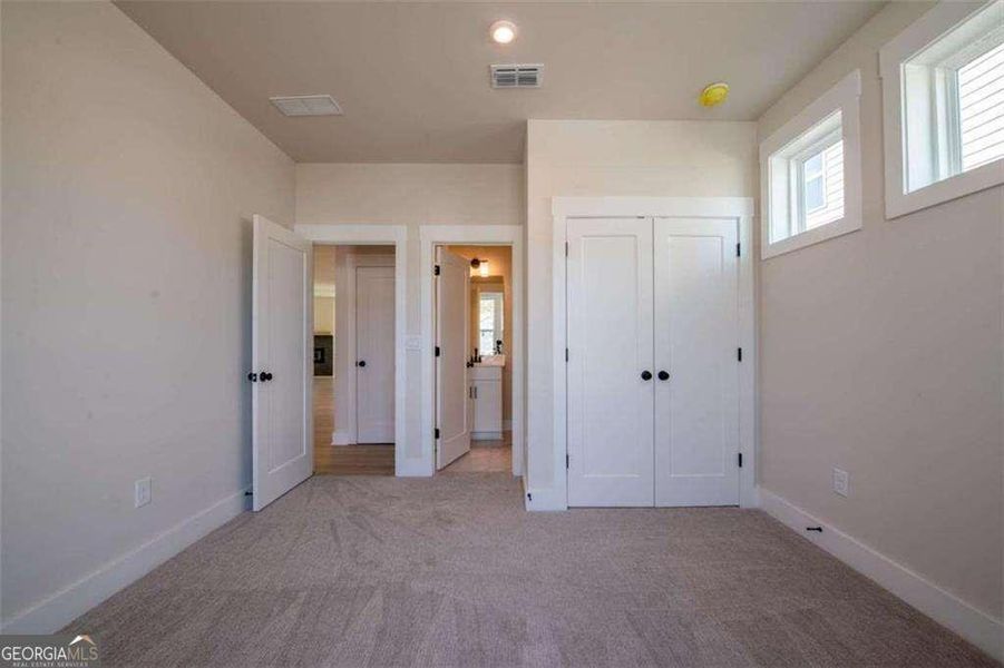 Spacious, unfurnished interior of a new home in The Paddocks at Doc Hughes, Buford (Image 26).