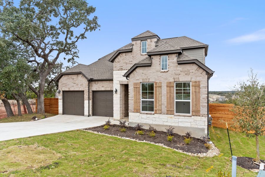 Representative exterior photo of a completed home built from the Waterville by Ashton Woods in Berry Creek Highlands, Georgetown, TX (Image 2). Representative exterior photo of a completed home built from the Waterville by Ashton Woods in Berry Creek Highlands, Georgetown, TX (Image 2).