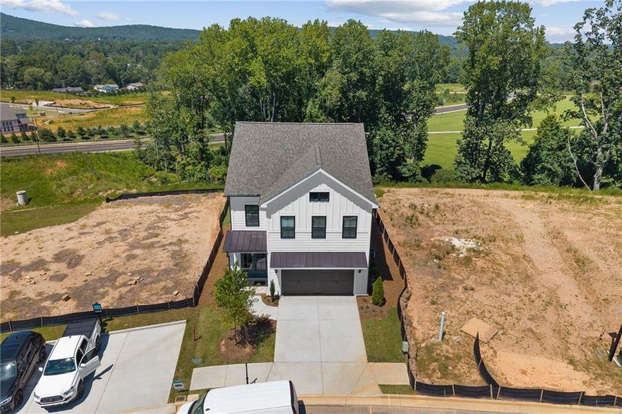 Front exterior of a new home in , Cumming, GA, highlighting curb appeal (Image 32).