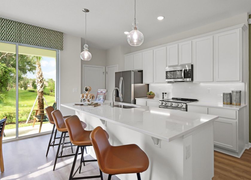 This Home Features White Cabinetry & Luxury Vinyl Plank Flooring