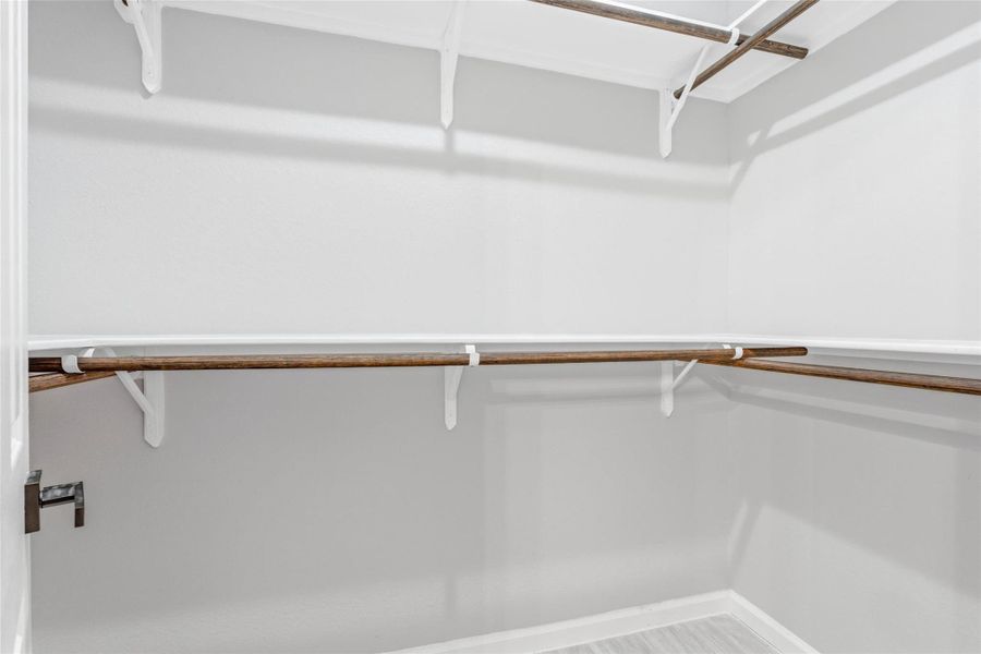 One of TWO spacious walk-in closets in the primary suite.