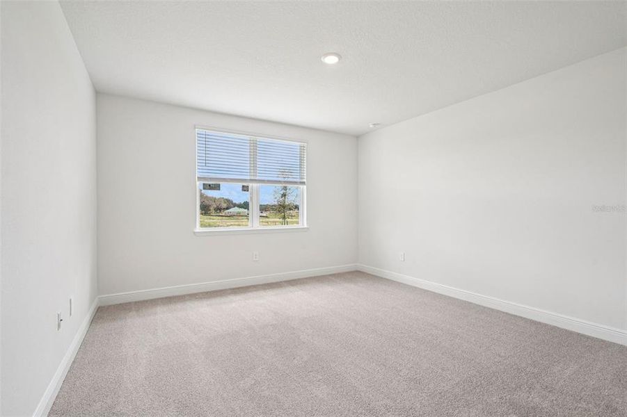 Spacious, unfurnished interior of a new home in The Reserve at Hammock Oaks - Signature Series, Lady Lake (Image 28).