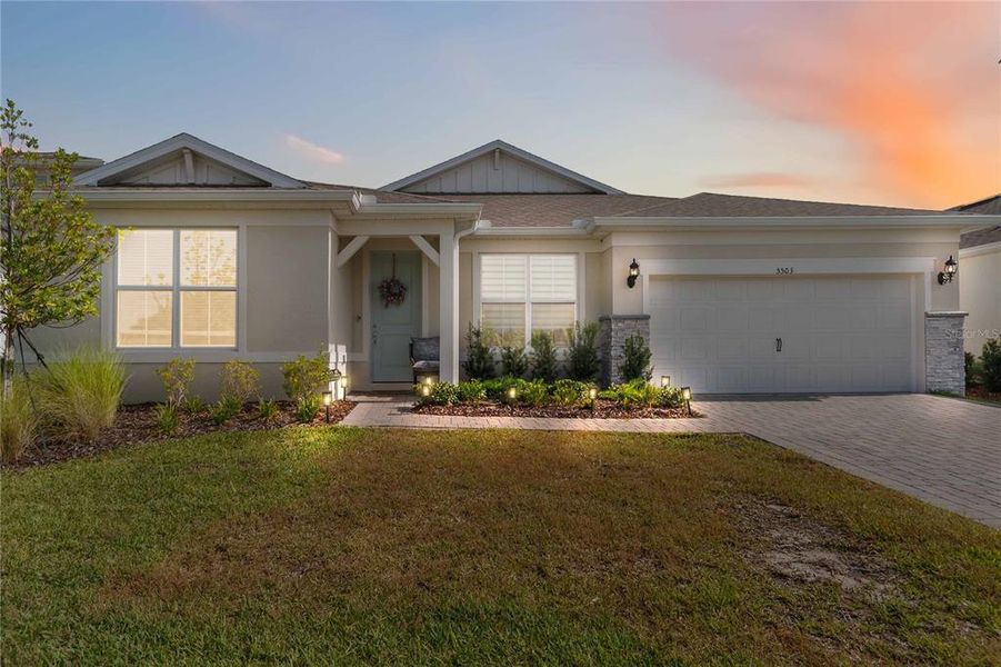 Front exterior of a new home in Bridgewalk, St. Cloud, FL, highlighting curb appeal (Image 24). Front exterior of a new home in Bridgewalk, St. Cloud, FL, highlighting curb appeal (Image 24).