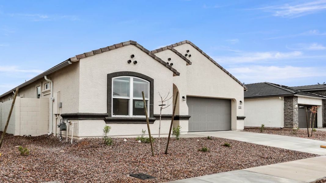 Representative exterior photo of a completed home built from the McCormick by D.R. Horton in Rio Rancho Estates, Surprise, AZ (Image 17).