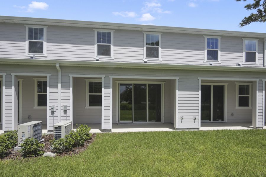 Exterior details and patio area of a home in Towns at Riverwalk, Sanford (Image 1). Exterior details and patio area of a home in Towns at Riverwalk, Sanford (Image 1).