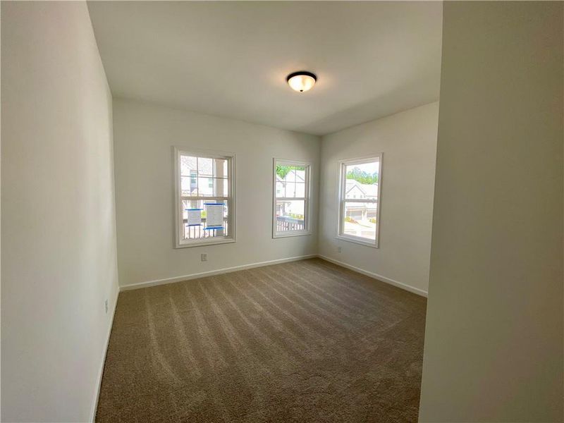 Spacious, unfurnished interior of a new home in Eastlyn Crossing, Flowery Branch (Image 15).