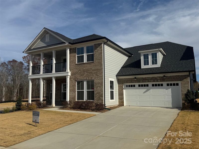 Front exterior of a new home in Forest Creek, Waxhaw, NC, highlighting curb appeal (Image 1).