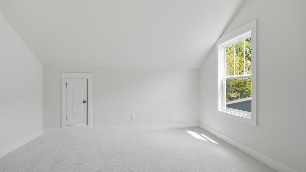 Functional space offering plush carpet underfoot and a thoughtfully planned walk-in closet