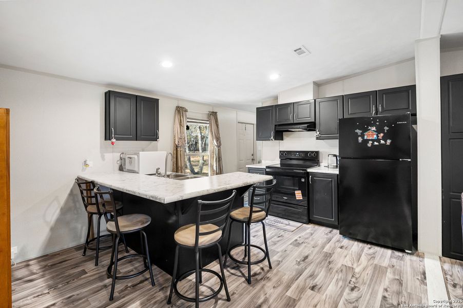 Furnished interior view inside a new home in , Elmendorf (Image 9).