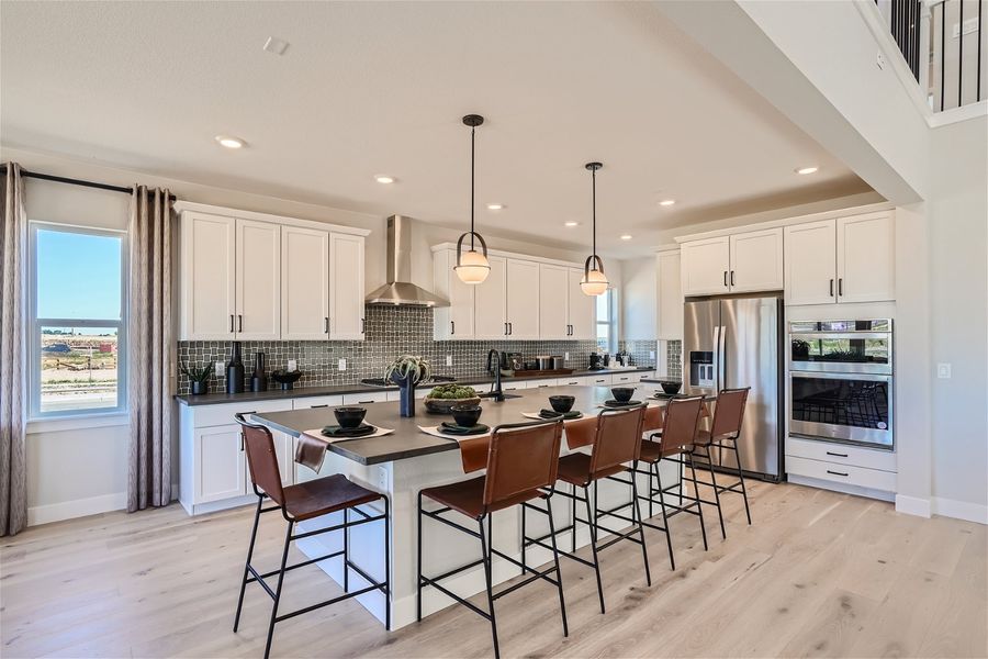 A kitchen with a bar and island. A kitchen with a bar and island.