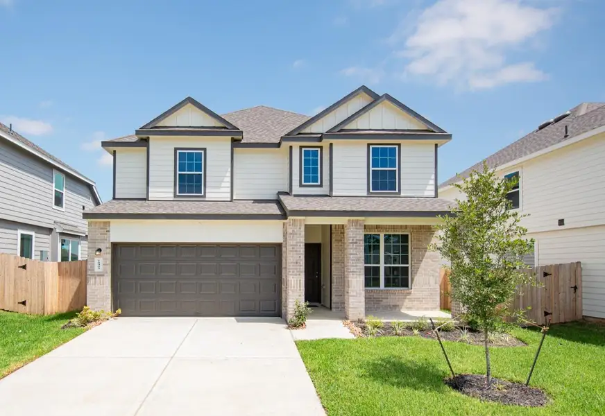 Front exterior of a new home in Granger Pines, Conroe, TX, highlighting curb appeal (Image 1).