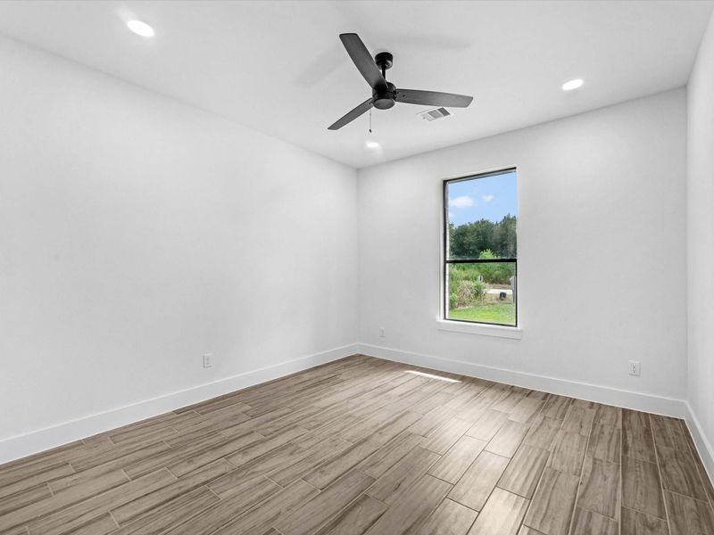 secondary bedrooms all feature a ceiling fan for extra comfort and custom closets.