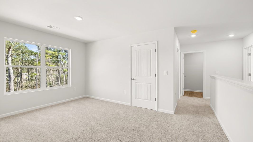 Representative unfurnished interior of a home built from the Hayden by D.R. Horton in Liberty Crossing, Braselton (Image 26).