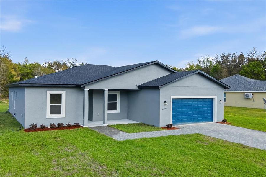 Front exterior of a new home in , Ocala, FL, highlighting curb appeal (Image 2). Front exterior of a new home in , Ocala, FL, highlighting curb appeal (Image 2).