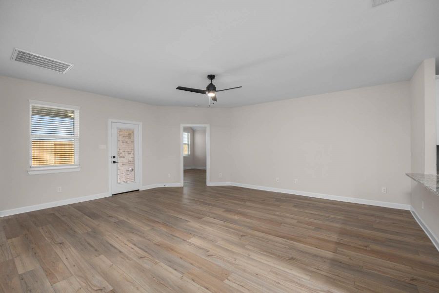 This large family room has a perfect view of the backyard, which is great for entertaining guests or just relaxing with family. The close proximity to the kitchen makes entertaining a breeze. This large family room has a perfect view of the backyard, which is great for entertaining guests or just relaxing with family. The close proximity to the kitchen makes entertaining a breeze.