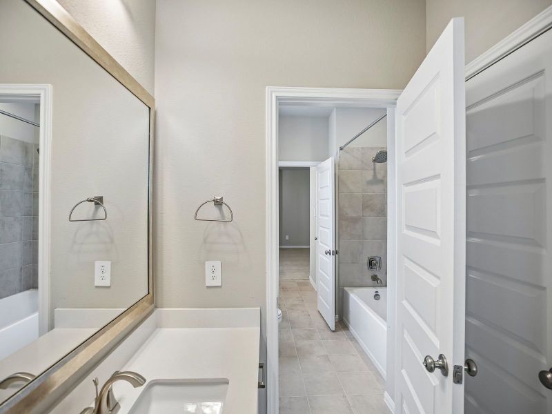 Furnished interior view inside a new home in Massey Oaks - Estate Series, Pearland (Image 11). Furnished interior view inside a new home in Massey Oaks - Estate Series, Pearland (Image 11).