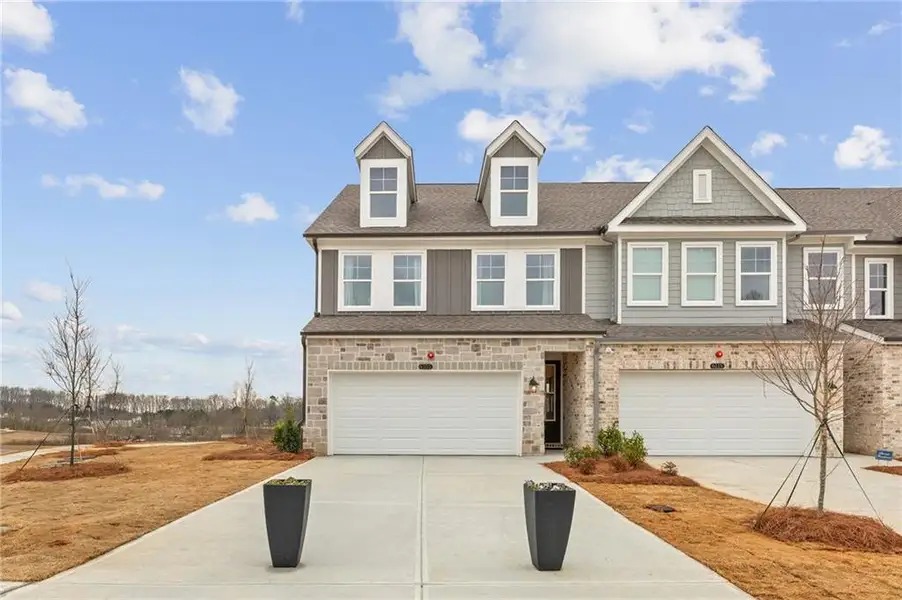 Front exterior of a new home in Hemingway, Cumming, GA, highlighting curb appeal (Image 1). Front exterior of a new home in Hemingway, Cumming, GA, highlighting curb appeal (Image 1).