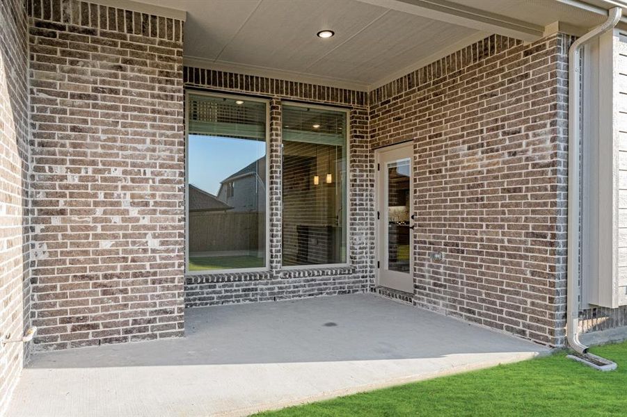 Exterior details and patio area of a home in Woodstone, Providence Village (Image 3). Exterior details and patio area of a home in Woodstone, Providence Village (Image 3).