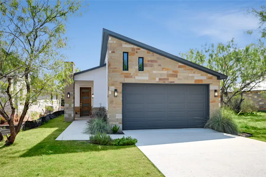 Front exterior of a new home in , Horseshoe Bay, TX, highlighting curb appeal (Image 1). Front exterior of a new home in , Horseshoe Bay, TX, highlighting curb appeal (Image 1).