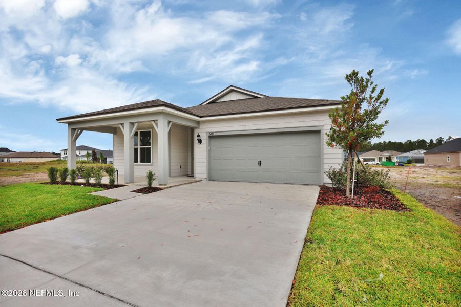 Front exterior of a new home in Hyland Trail, Green Cove Springs, FL, highlighting curb appeal (Image 22). Front exterior of a new home in Hyland Trail, Green Cove Springs, FL, highlighting curb appeal (Image 22).