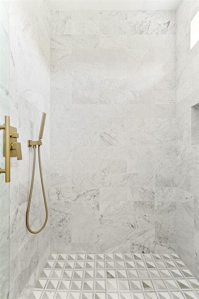 Bathroom featuring a tile shower