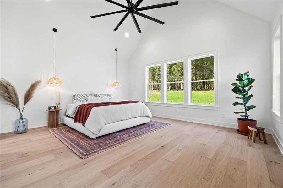 Bedroom featuring high vaulted ceiling, light wood-style flooring, ceiling fan, and recessed lighting
