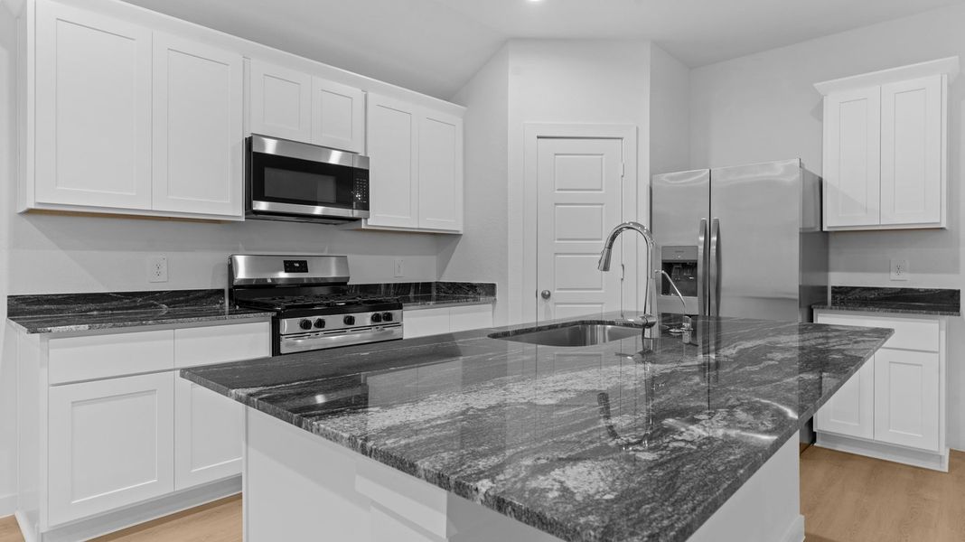 Furnished interior view inside a new home in Caldwell Crossing, Iowa Colony (Image 4).