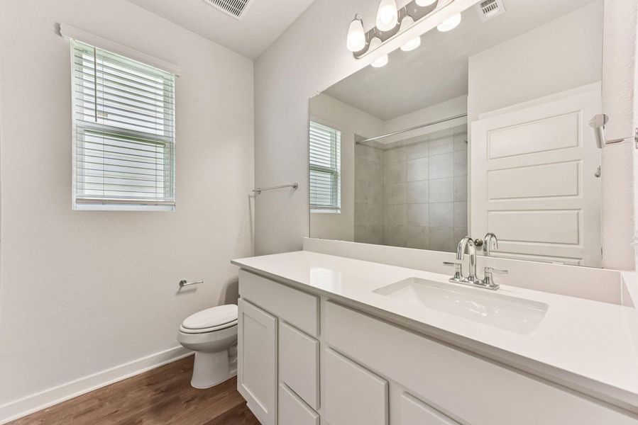 Furnished interior view inside a new home in Stallion Run, Buda (Image 16).