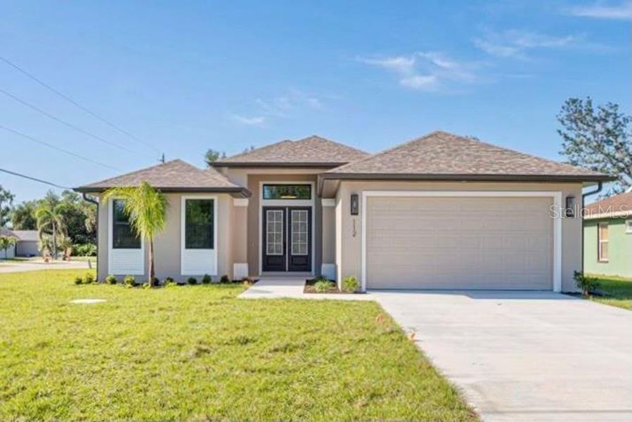 Front exterior of a new home in , Rotonda West, FL, highlighting curb appeal (Image 1).