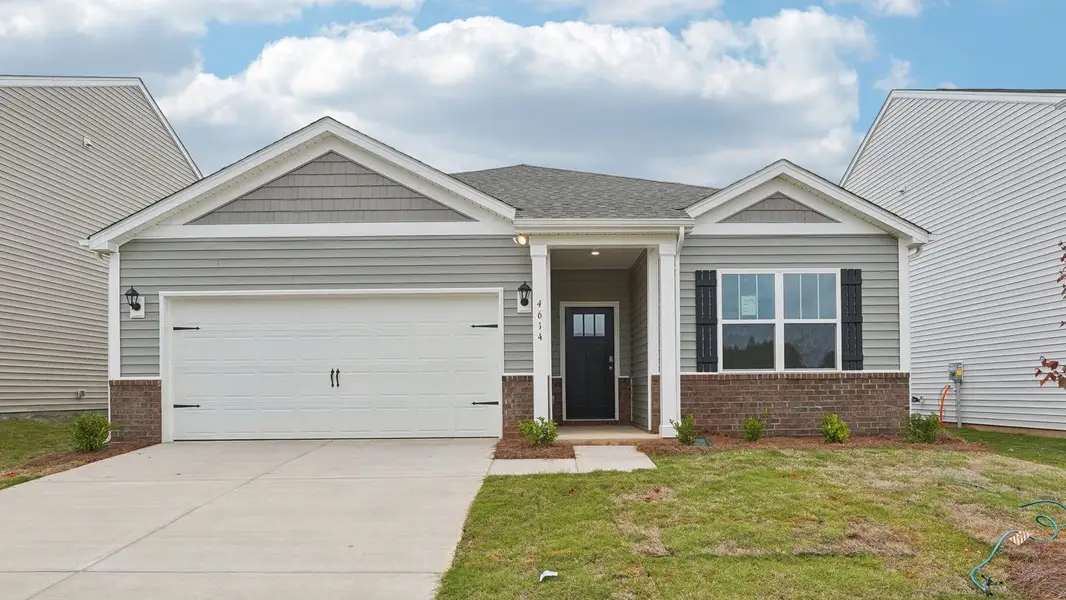 Front exterior of a new home in The Hamptons at Hickory, Hickory, NC, highlighting curb appeal (Image 1). Front exterior of a new home in The Hamptons at Hickory, Hickory, NC, highlighting curb appeal (Image 1).
