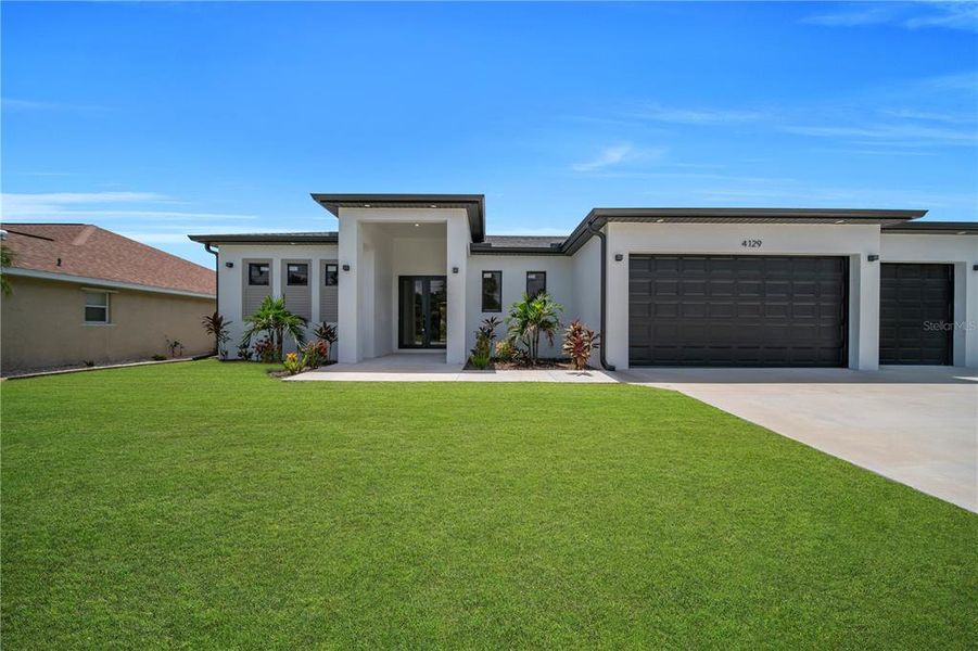 Front exterior of a new home in , Port Charlotte, FL, highlighting curb appeal (Image 2). Front exterior of a new home in , Port Charlotte, FL, highlighting curb appeal (Image 2).