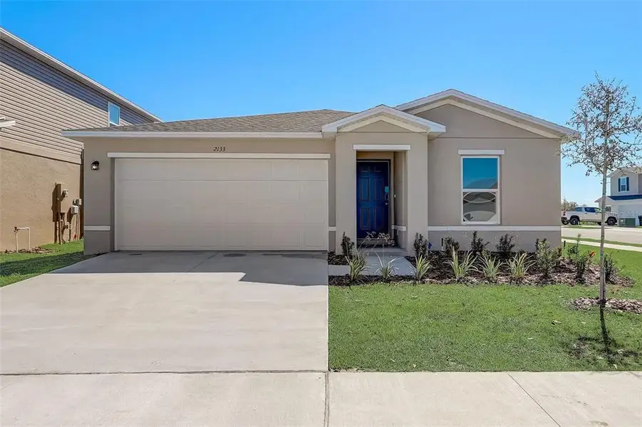 Front exterior of a new home in The Collection at Inverness, Inverness, FL, highlighting curb appeal (Image 18).