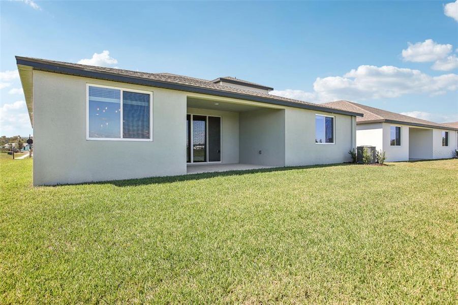 Exterior details and patio area of a home in Two Rivers - Signature Series, Zephyrhills (Image 23).