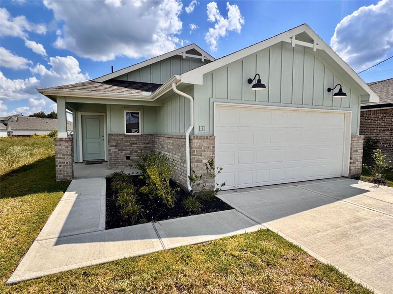 Front exterior of a new home in Santa Fe, Cleveland, TX, highlighting curb appeal (Image 2). Front exterior of a new home in Santa Fe, Cleveland, TX, highlighting curb appeal (Image 2).